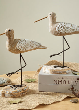 Zwei Möwen-Holzfiguren mit Flügel-Schuppenmuster und schwarzen Metallbeinen, von der Seite