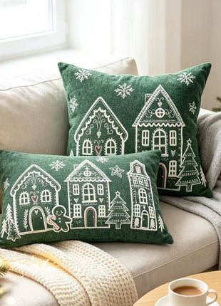 Deep green Christmas village pillows in square and lumbar styles