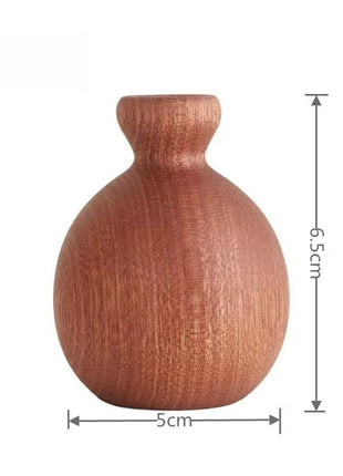 Holzvase in Birnenform, kugelig mit kurzem Hals, erdiges Braun, ca. 6,5 cm hoch