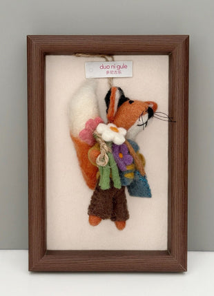 Flower fox wool felt charm displayed in a wooden frame