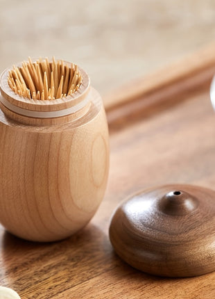 Zahnstocherbox Eichelform aus Holz mit geöffnetem Deckel und Zahnstocherbündel