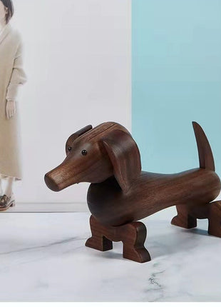 Dackel-Holzfigur aus dunklem Nussbaum, liegende Rückenansicht