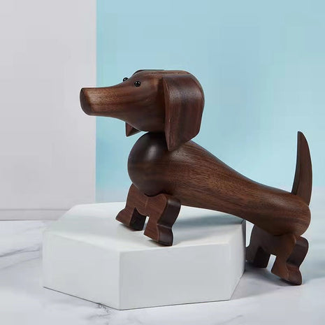 Holzfigur eines Dackels aus dunklem Nussbaum mit beweglicher Drehbasis