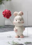 Glückskaninchen mit roten Blümchen