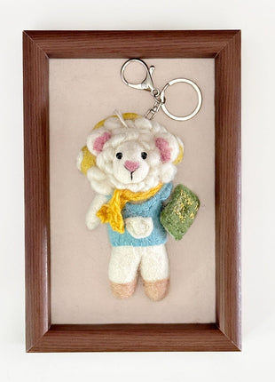 Reading sheep charm with a silver-tone keyring