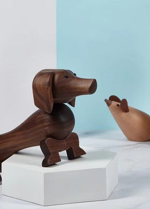 Dackel-Holzfigur mit zwei Metallaugen aus dunklem Nussbaum, sitzend