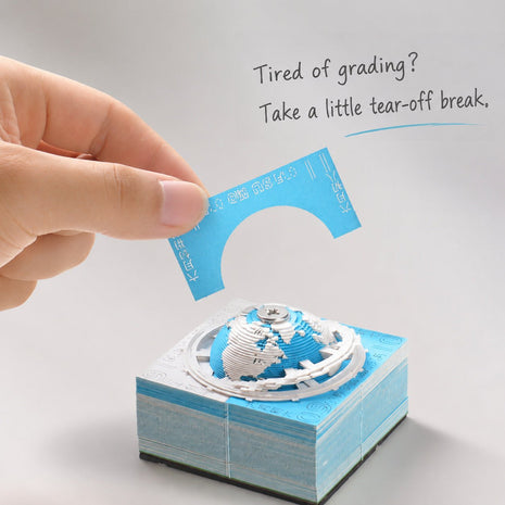 A page being peeled from an Earth paper sculpture memo pad