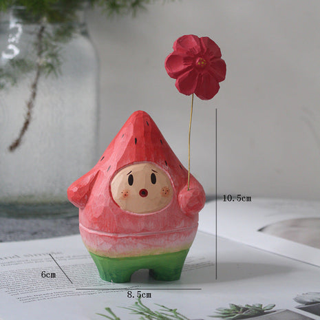 Holzfigur: roter Wassermelonen-Mensch mit roter Blume am Draht