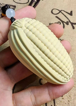 Korn-Anhänger aus Naturholz, oval mit Rillen, hellgelb, Perlenband am oberen Ende