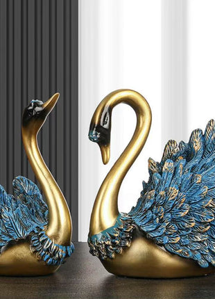 Schwanenpaar Deko-Skulpturen mit blauen Federflügeln und goldfarbenem Körper