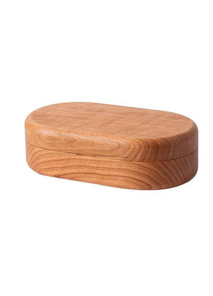 Geschlossene ovale Holz-Schmuckbox, kompakte runde Form ohne sichtbare Fächer