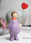 Lila Puppe mit Herzchen