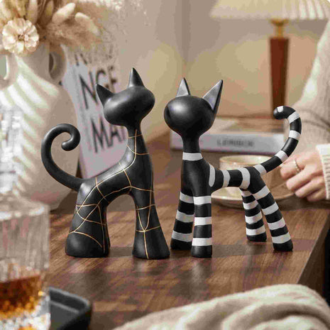 Dekofigur Katzenpaar: schwarze Katzen mit goldenen Linien und gestreiftem Schwanz