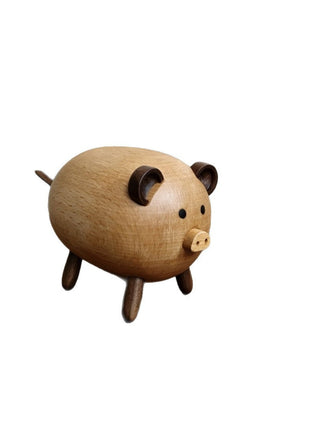 Schweinchen aus Massivholz mit aufgestelltem Schwanz und Holzaugen, Tierfigur