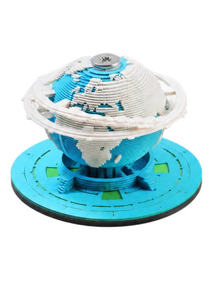Blue and white Earth paper sculpture on a blue base