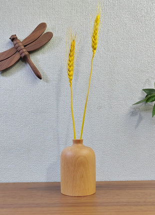 Kleine Holzvase aus Buche mit schlanker Öffnung und Holzstecker-Dekor