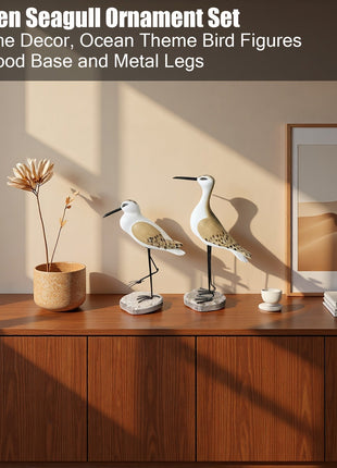 Seemöwen-Ornament-Set: zwei Holzfiguren mit Metallbeinen und runden Holzsockeln, weiß und braun.