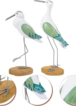 Zwei Möwenfiguren im Set, weißer Vogel, blaugrüne Flügel, Metallbeine und Holzsockel.