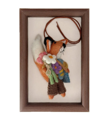 Flower fox charm with a brown cord attachment