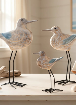Holz-Seevogel-Deko mit blauen Flügelakzenten, zwei Vögel auf schwarzen Metallbeinen