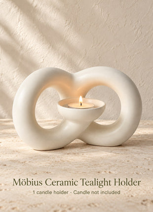 Ivory ceramic Mobius tealight holder with two flowing loops and one integrated candle bowl; candle not included
