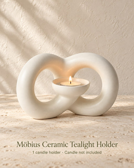 Ivory ceramic Mobius tealight holder with two flowing loops and one integrated candle bowl; candle not included